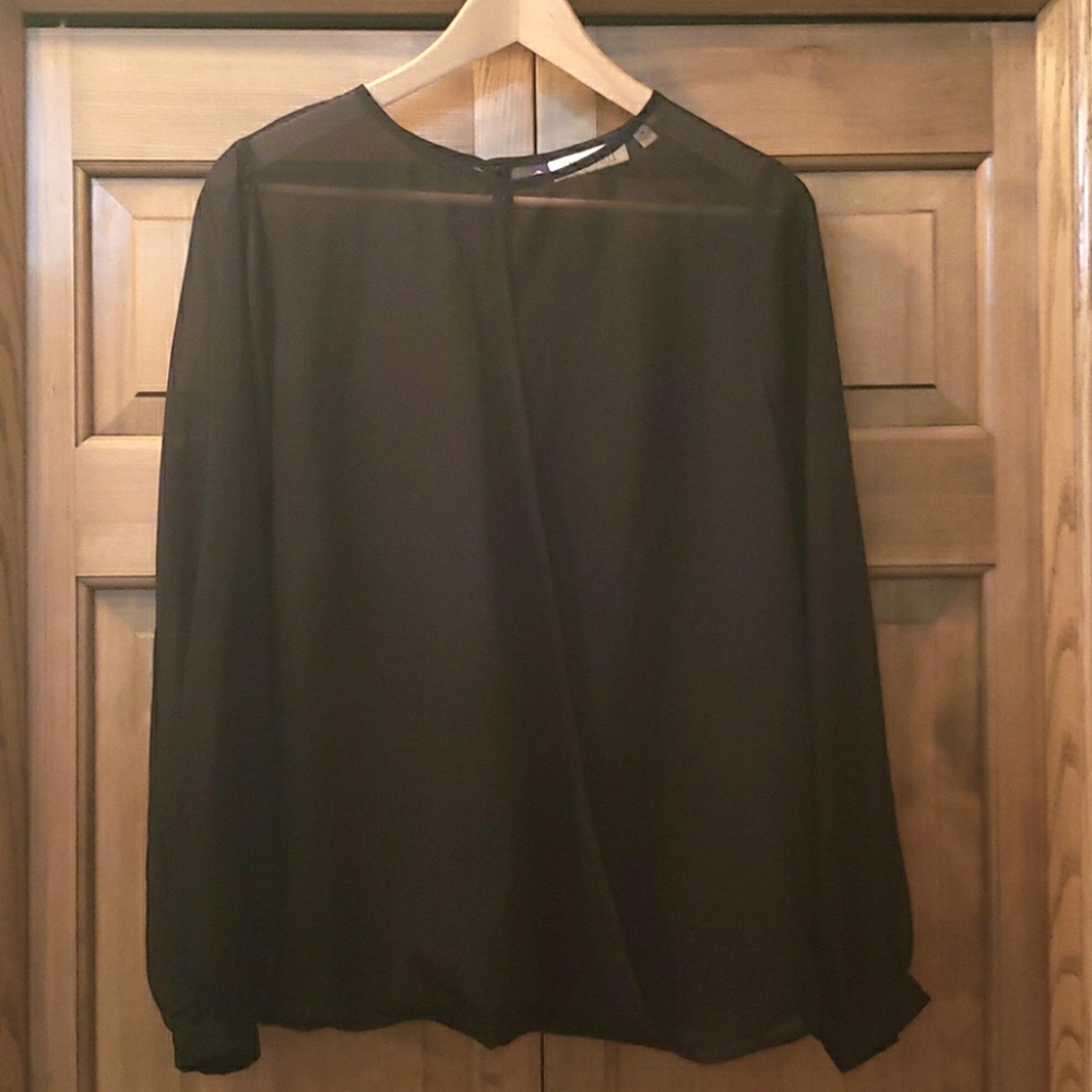 Sheer Jennifer Lopez crossover blouse